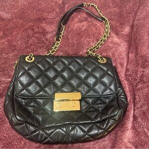 Michael Kors larger quilted black flap bag